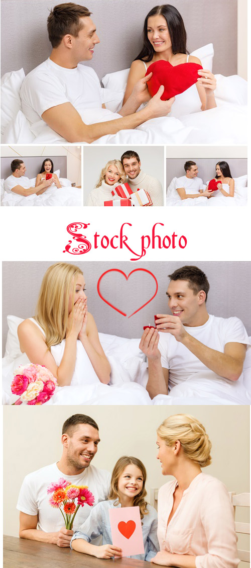 Smiling couple with red heart - stock photo