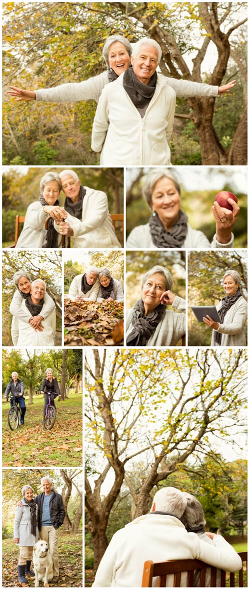 Happy elderly couple in autumn park - Stock photo
